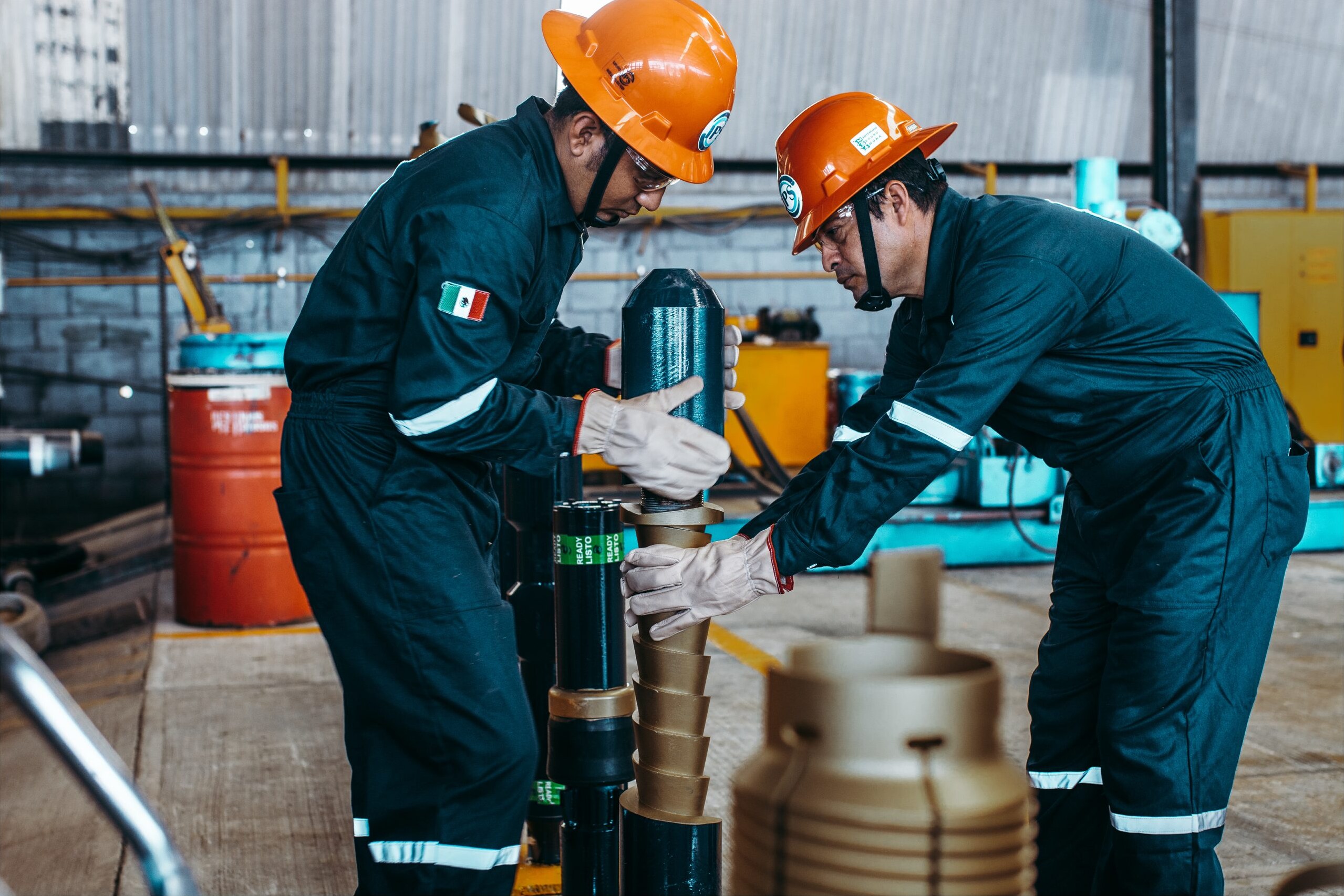 Technicians assembling cementing accessories in the workshop