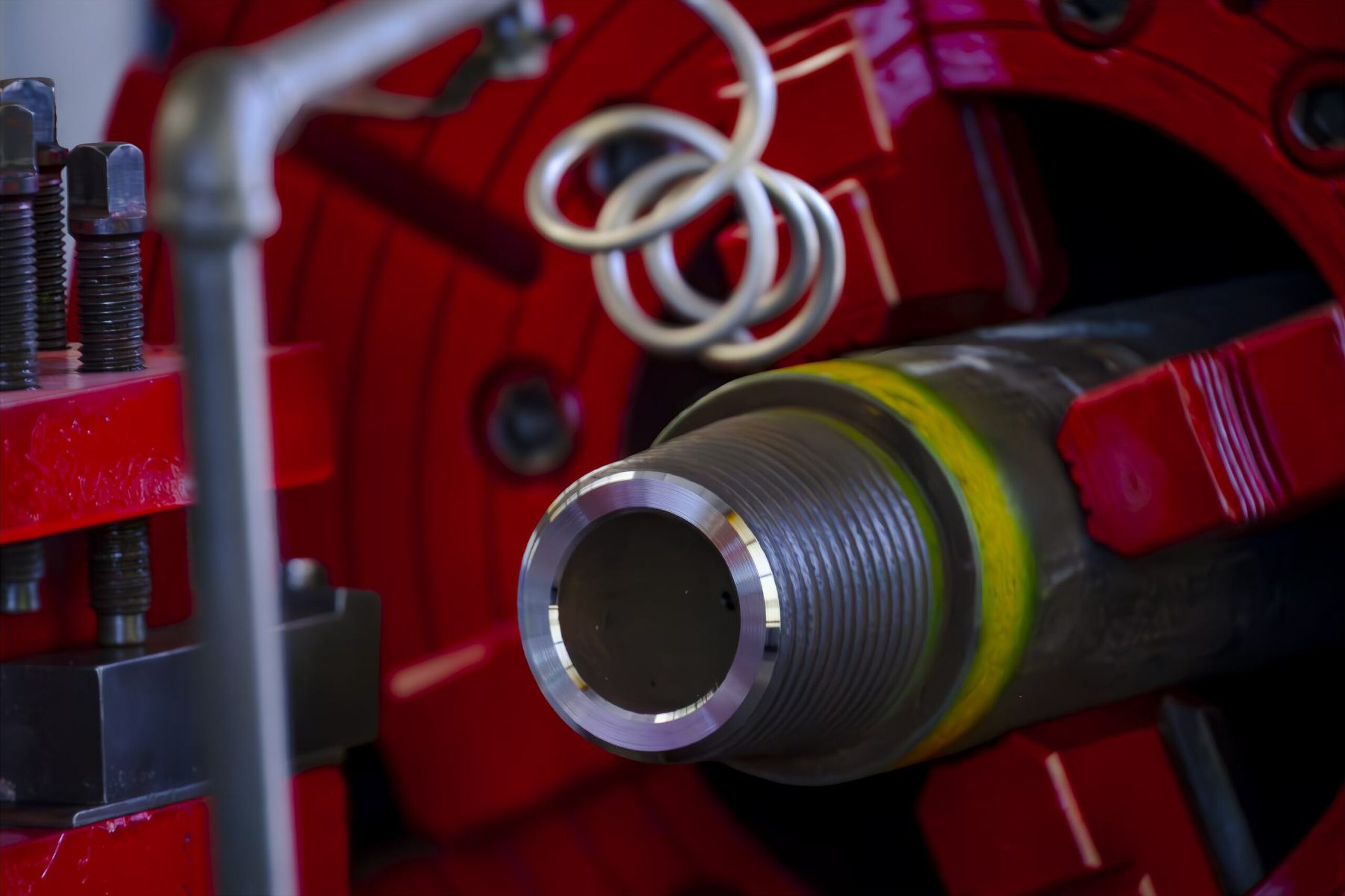 Production string connection held in a power tong