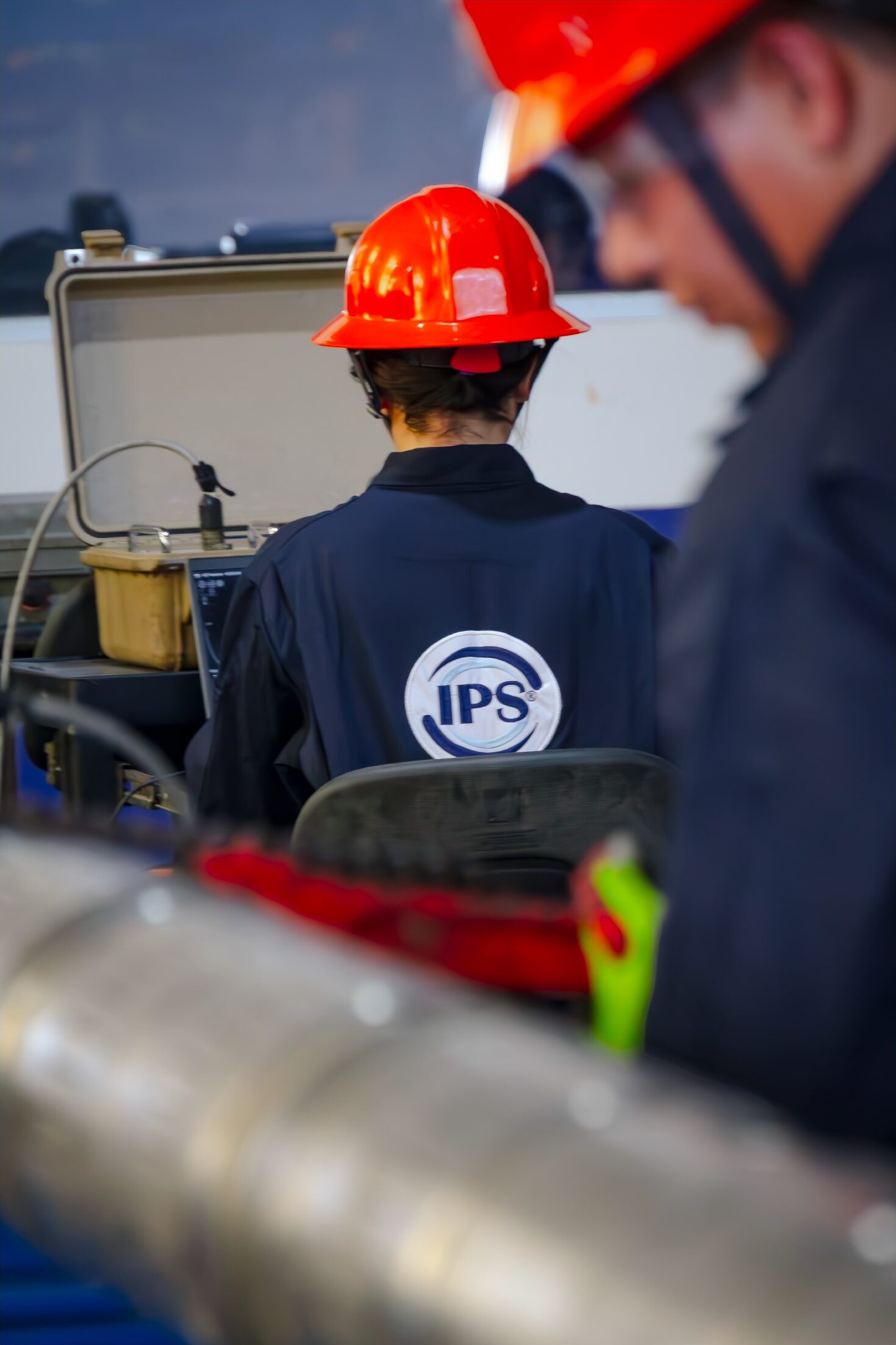 Technicians preparing cleaning tools at the base