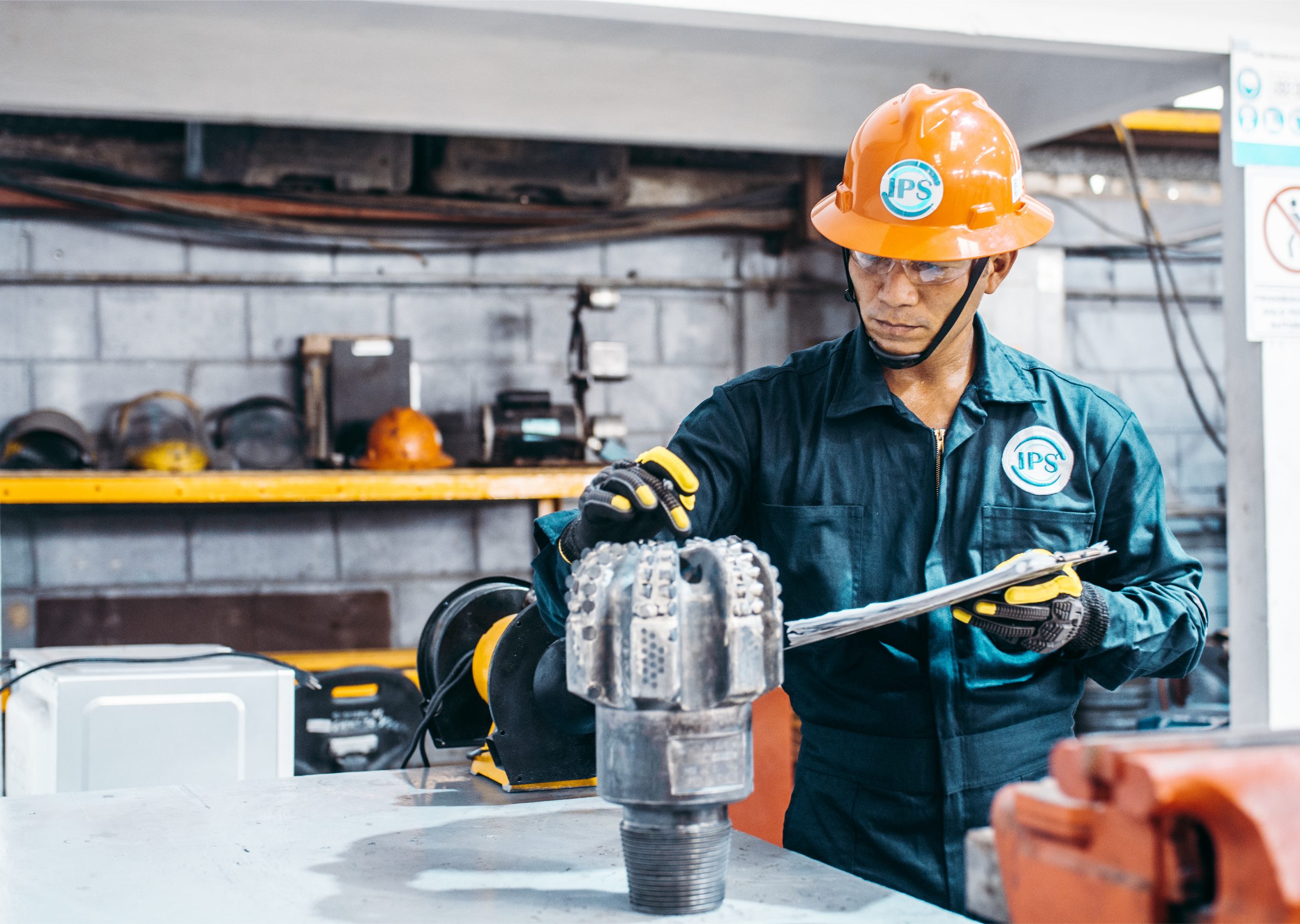 Technician handling a Velox PDC bit