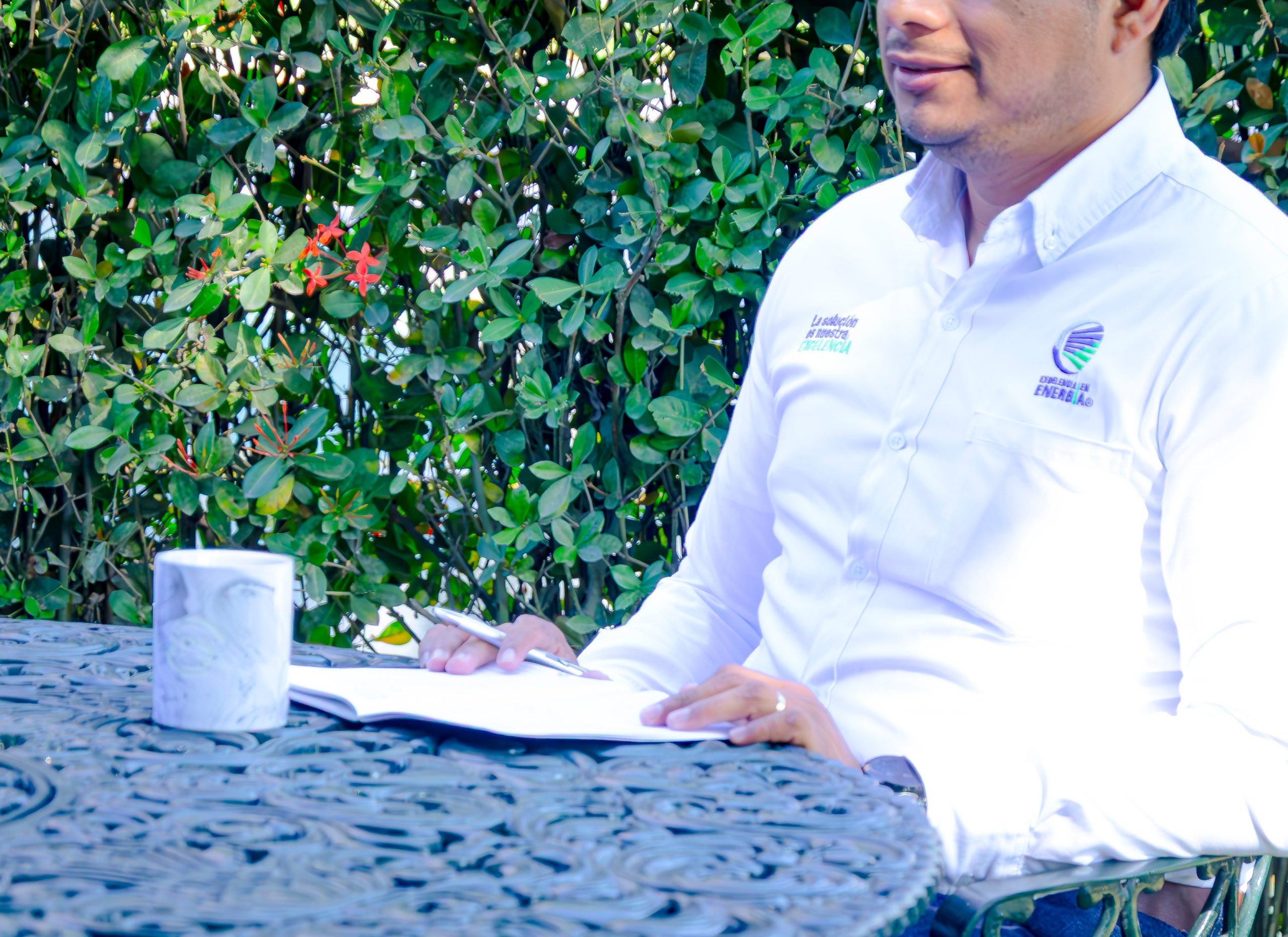 Grupo IPS engineer reviewing technical documents outdoors