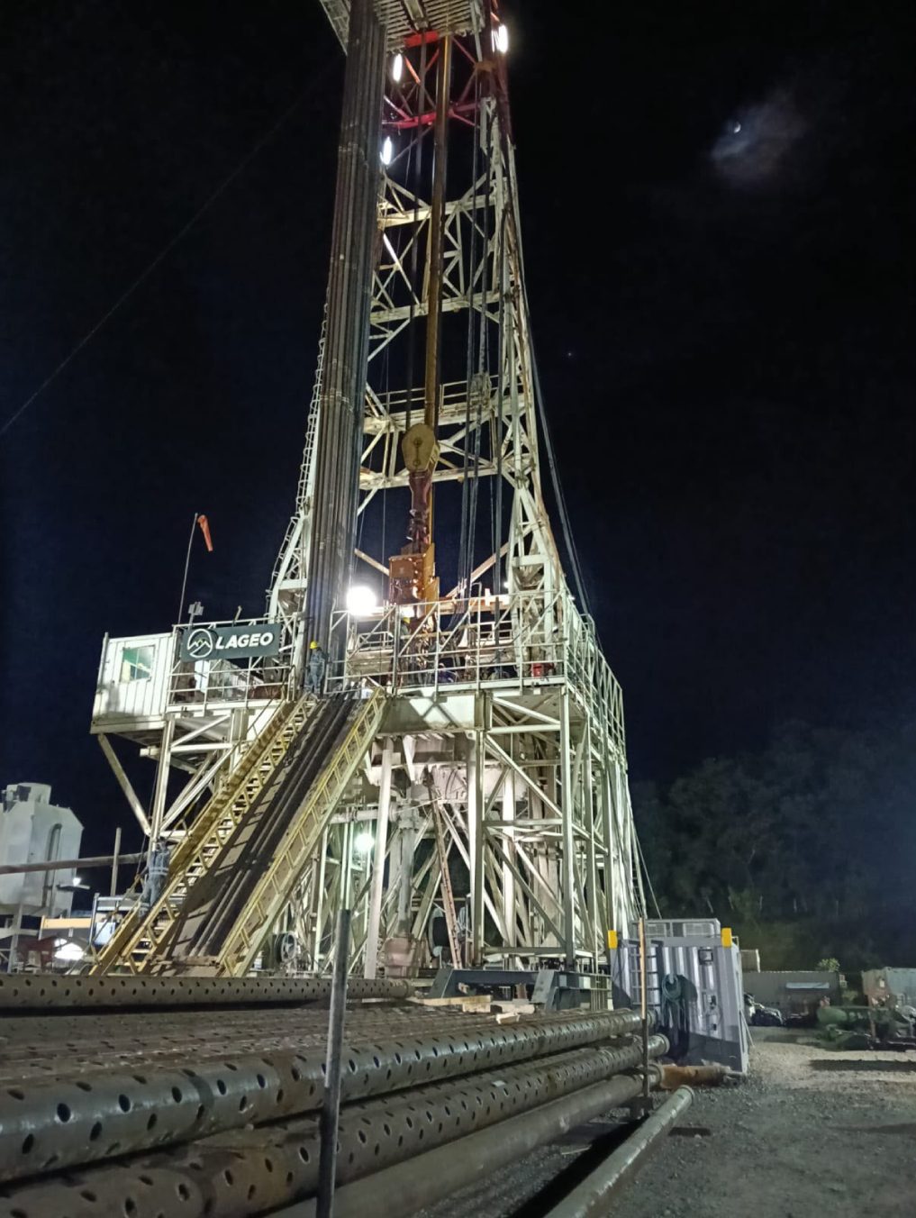 Illuminated drilling rig operating at night