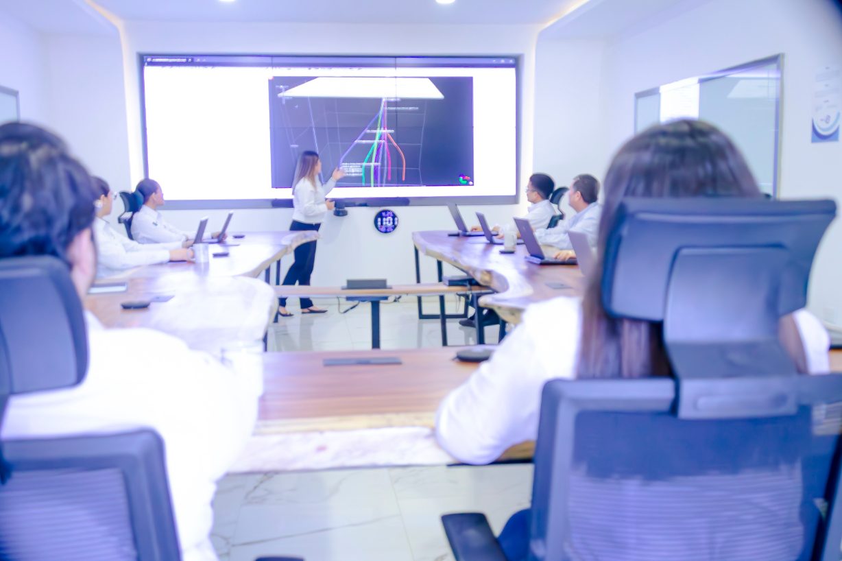 Project team following operations in a monitoring room