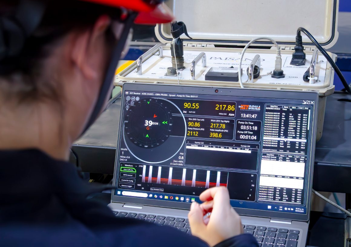 Operator monitoring well data on a laptop