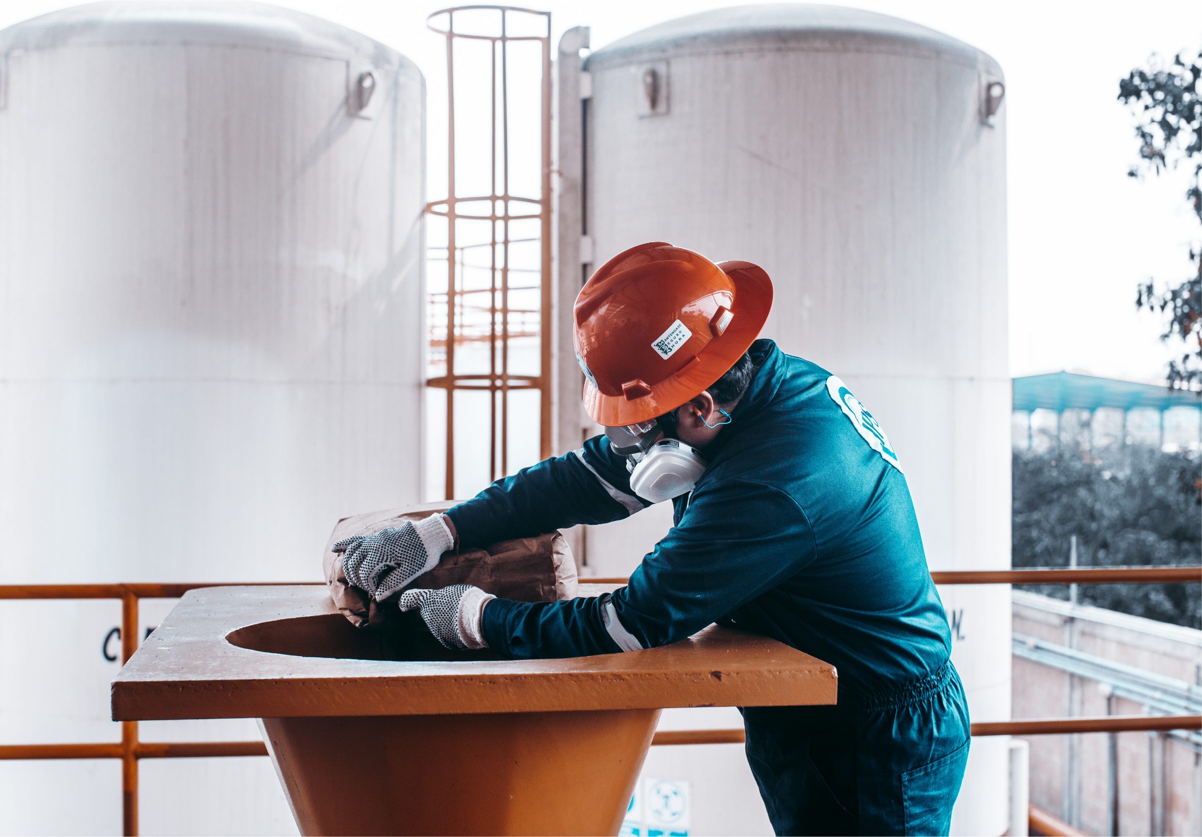 Technician preparing a carrier system at the mixing hopper